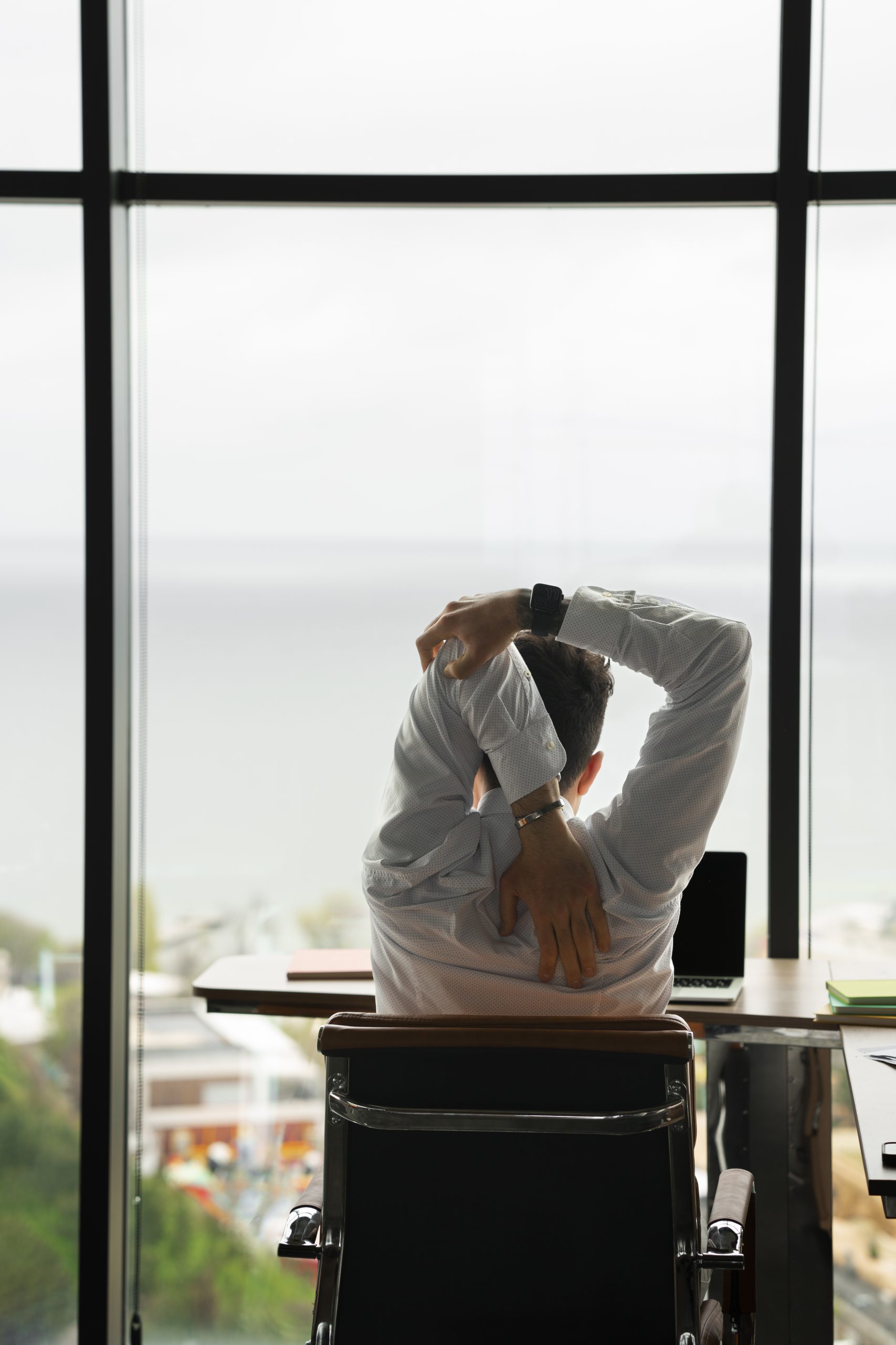 back-view-man-stretching-work